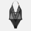 Broderad bodysuit med spetsar Broderad bodysuit med spetsar