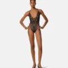 Broderad bodysuit med spetsar Broderad bodysuit med spetsar