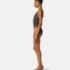 Broderad bodysuit med spetsar Broderad bodysuit med spetsar