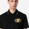 Broderad polotröja med spänne Broderad polotröja med spänne