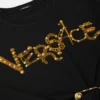 Kort T-shirt med nitar och säkerhetsnål